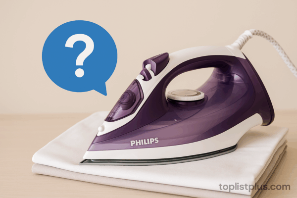 ภาพเตารีดไอน้ำ Philips รุ่นไหนดี บนผ้าพับเรียบ พร้อมสัญลักษณ์คำถาม