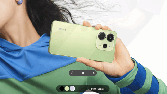 รูปภาพหน้าปกบทความเปรียบเทียบโทรศัพท์ Redmi vs Infinix โดยแสดงให้เห็นโทรศัพท์ Redmi สีเขียวอ่อนถูกถืออยู่ในมือ